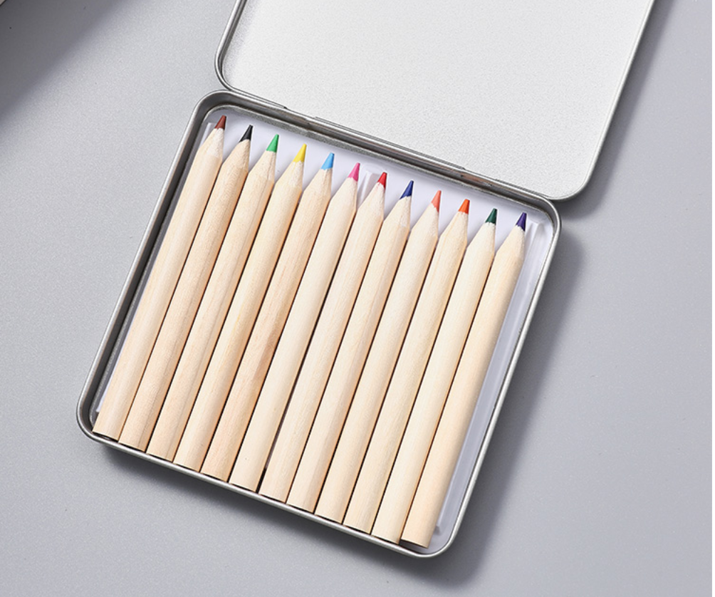 Custom Colour Pencil Set is available here at TREA. This set of wood colour pencils are kept inside an iron box container. These small wood colour pencils are paint-free. Lightweight and compact, ideal for students and also as a gift for any school events.

 	Material: Wood / Iron
 	Paint-Free
 	Iron Box Container
 	Dimension: Box: 10cm x 9.5cm x 0.9cm
 	Colour Pencils: 8.8cm x 0.72cm
 	Colours: Original Wood Colour

Minimum order quantity of 100pc is required for this product, any design can be printed, wholesale price applies!
Contact us for full customisation wholesale rate for bulk order!

 